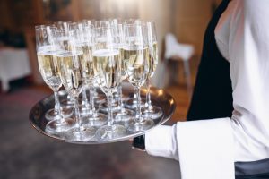 waiter serving beverage tray restaurant 300x200
